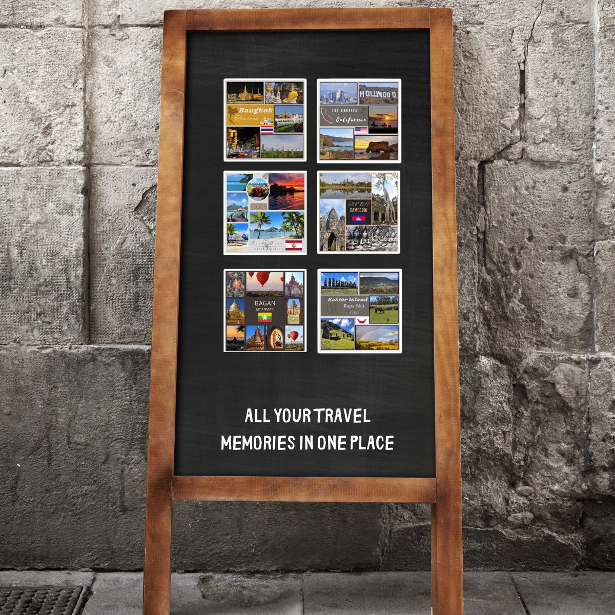 Blackboard with travel memories collage and wooden frame against a stone wall.