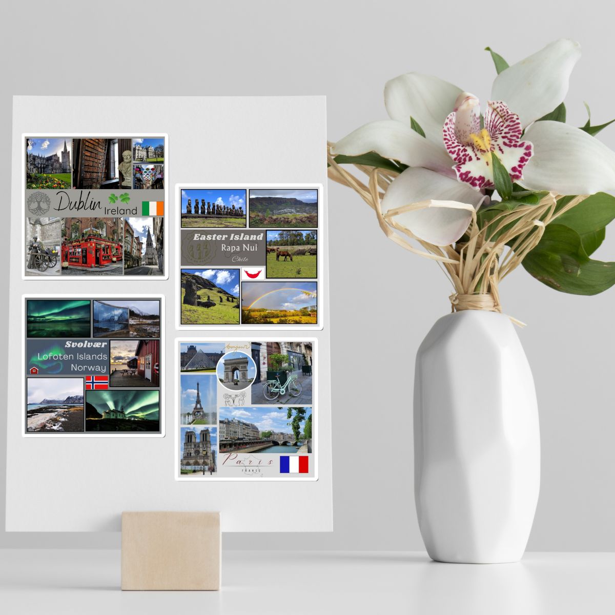 Collage of travel photos on a wall with a white vase containing flowers.