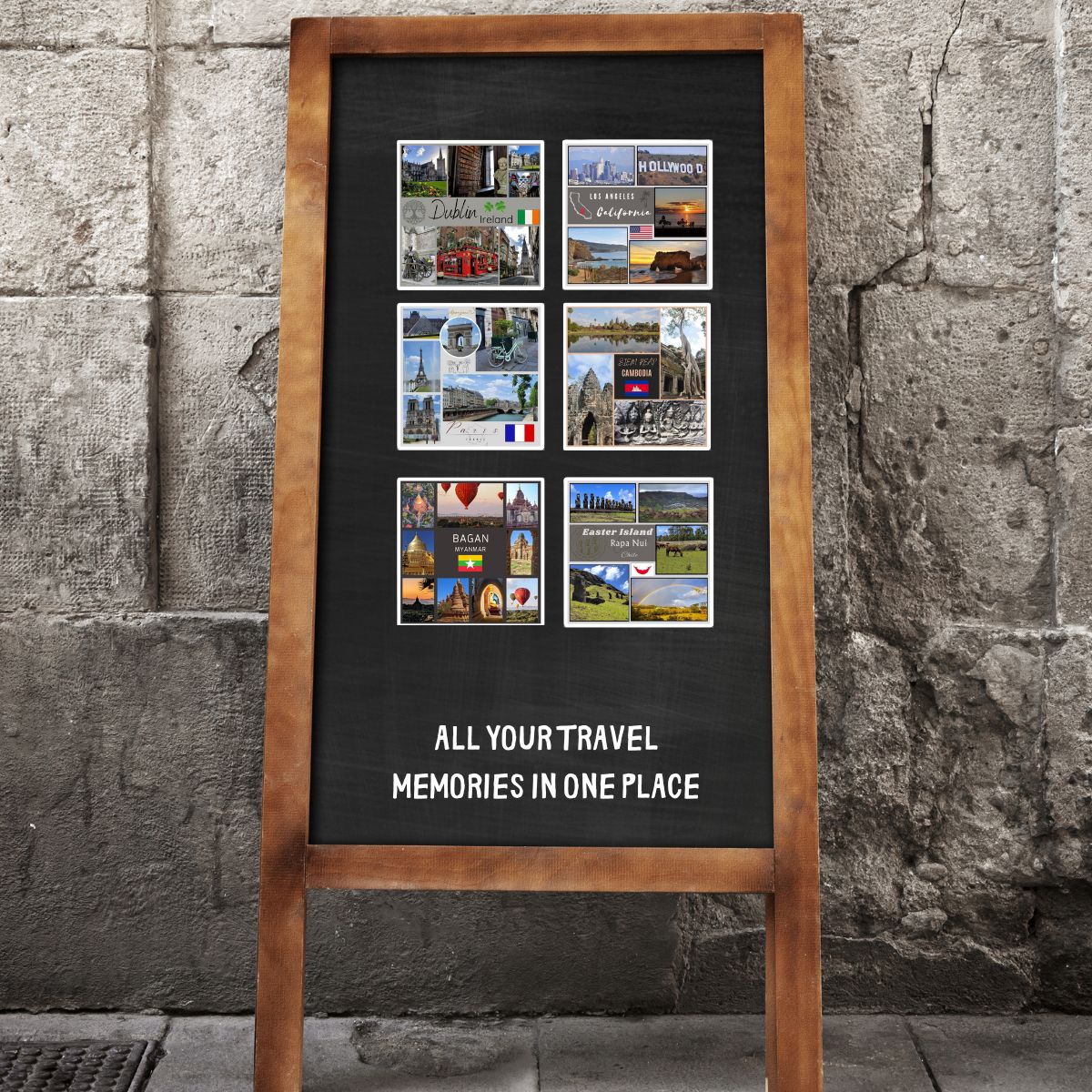 A chalkboard sign with travel memories collage against a stone wall.