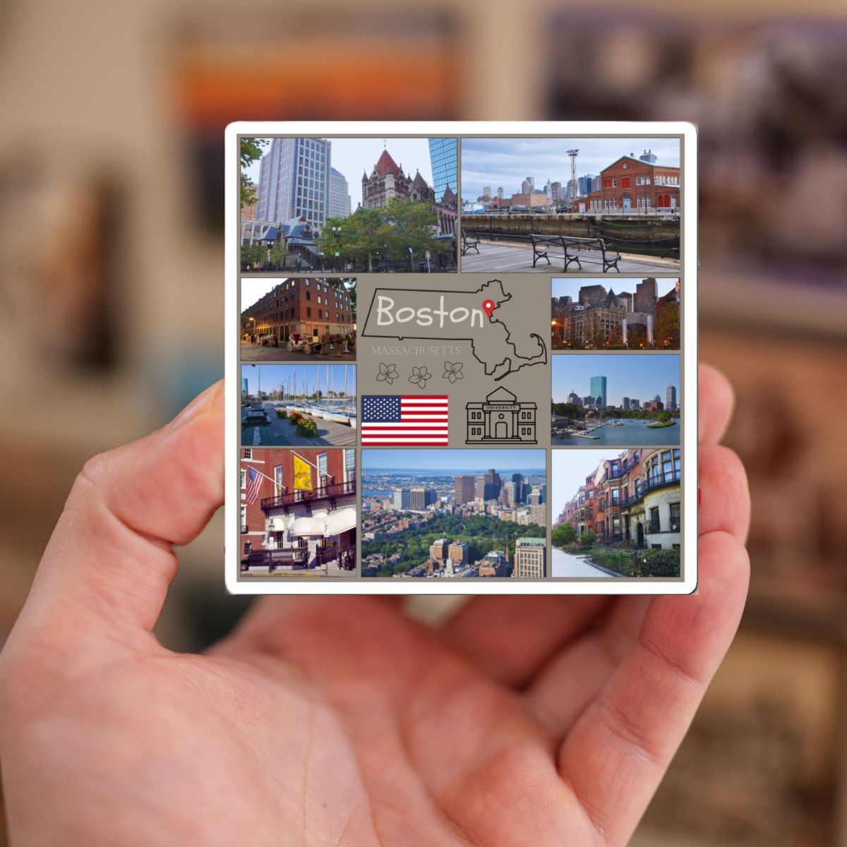 Hand holding a small card with images of Boston and text.