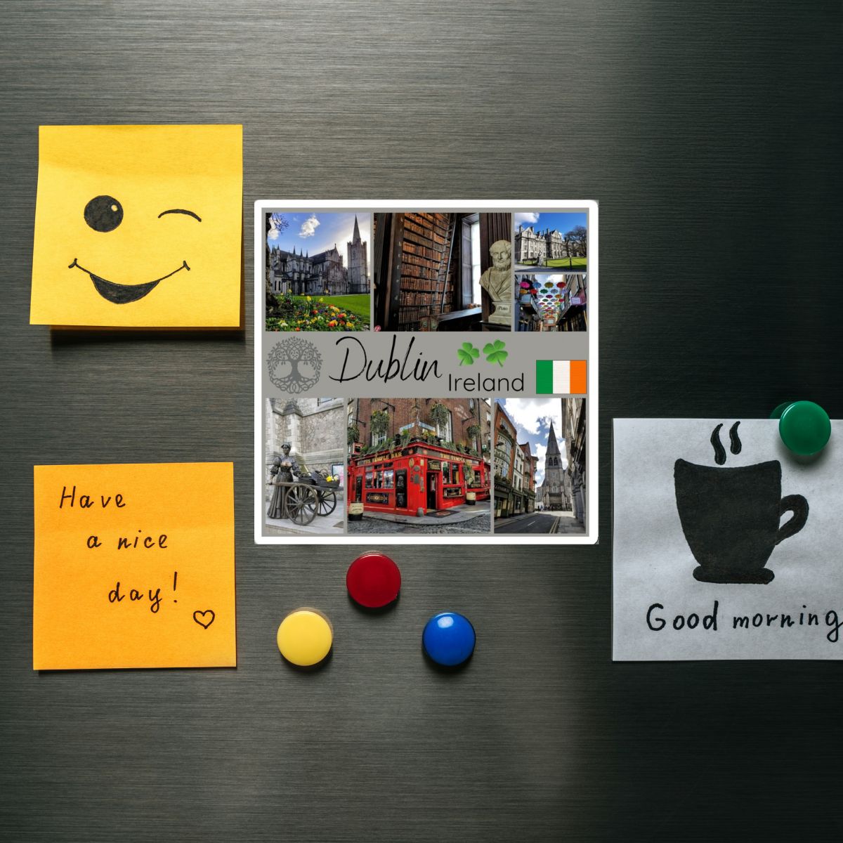 Fridge magnets with a smiley face, 'Have a nice day!' message, and 'Good morning' illustration on a metallic surface.