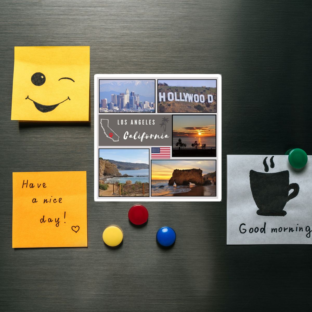 Fridge magnets with a smiley face, scenic views of Los Angeles, and motivational messages on a metallic surface.