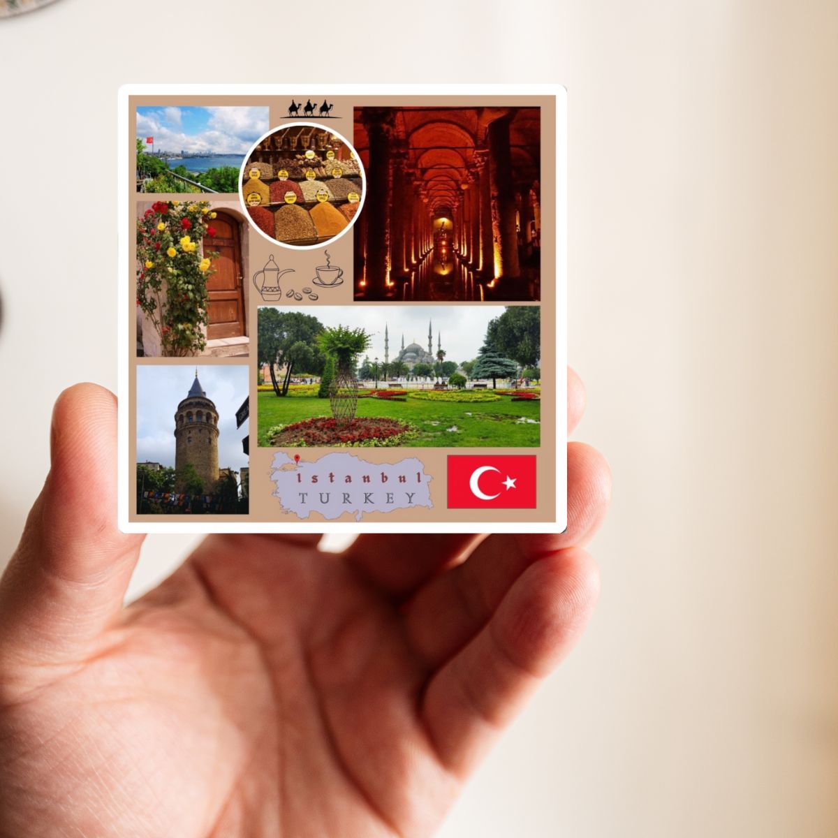 Hand holding a postcard with images of Istanbul, Turkey