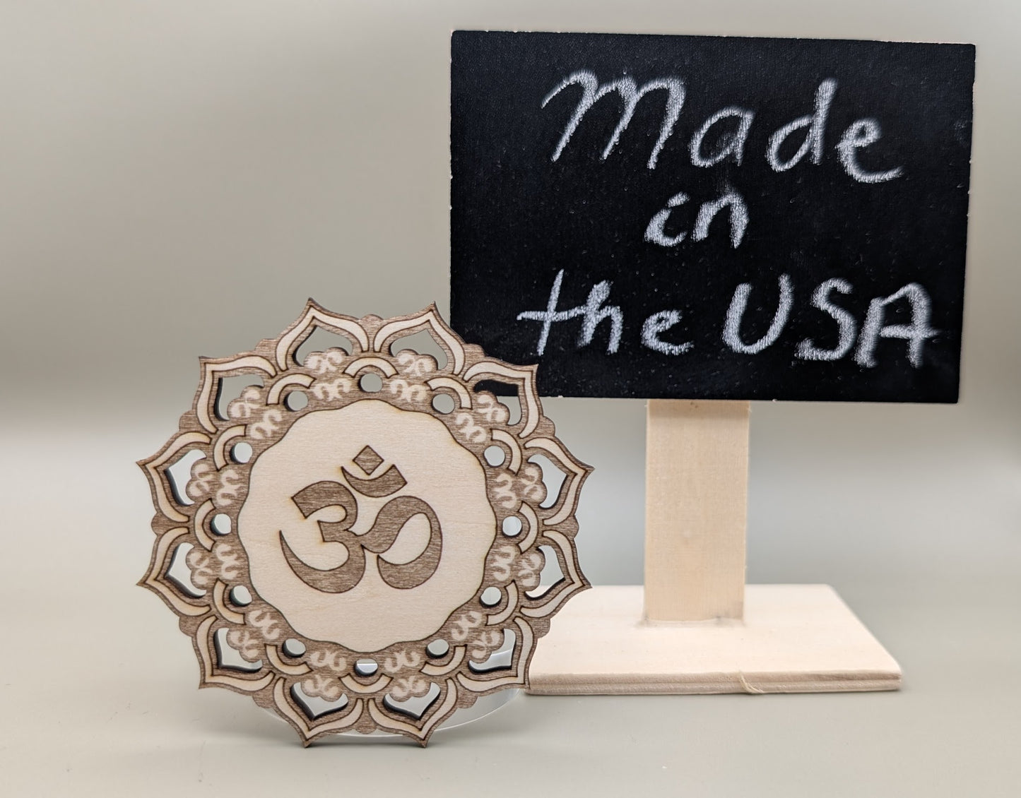 Decorative wooden symbol with 'Made in the USA' sign