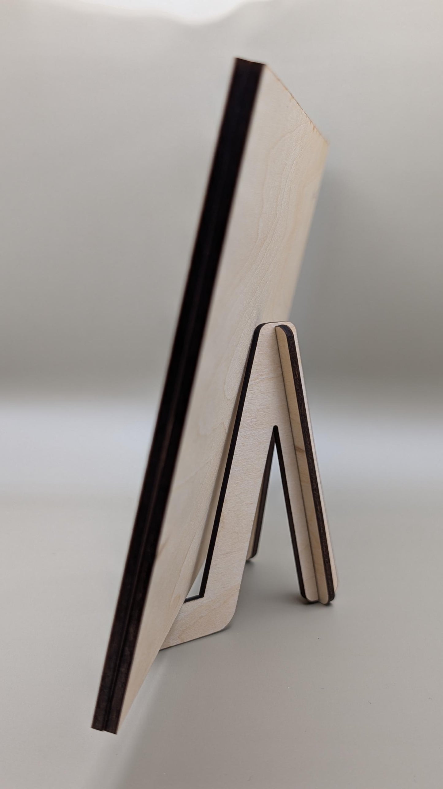Wooden stand with a black border on a light gray background
