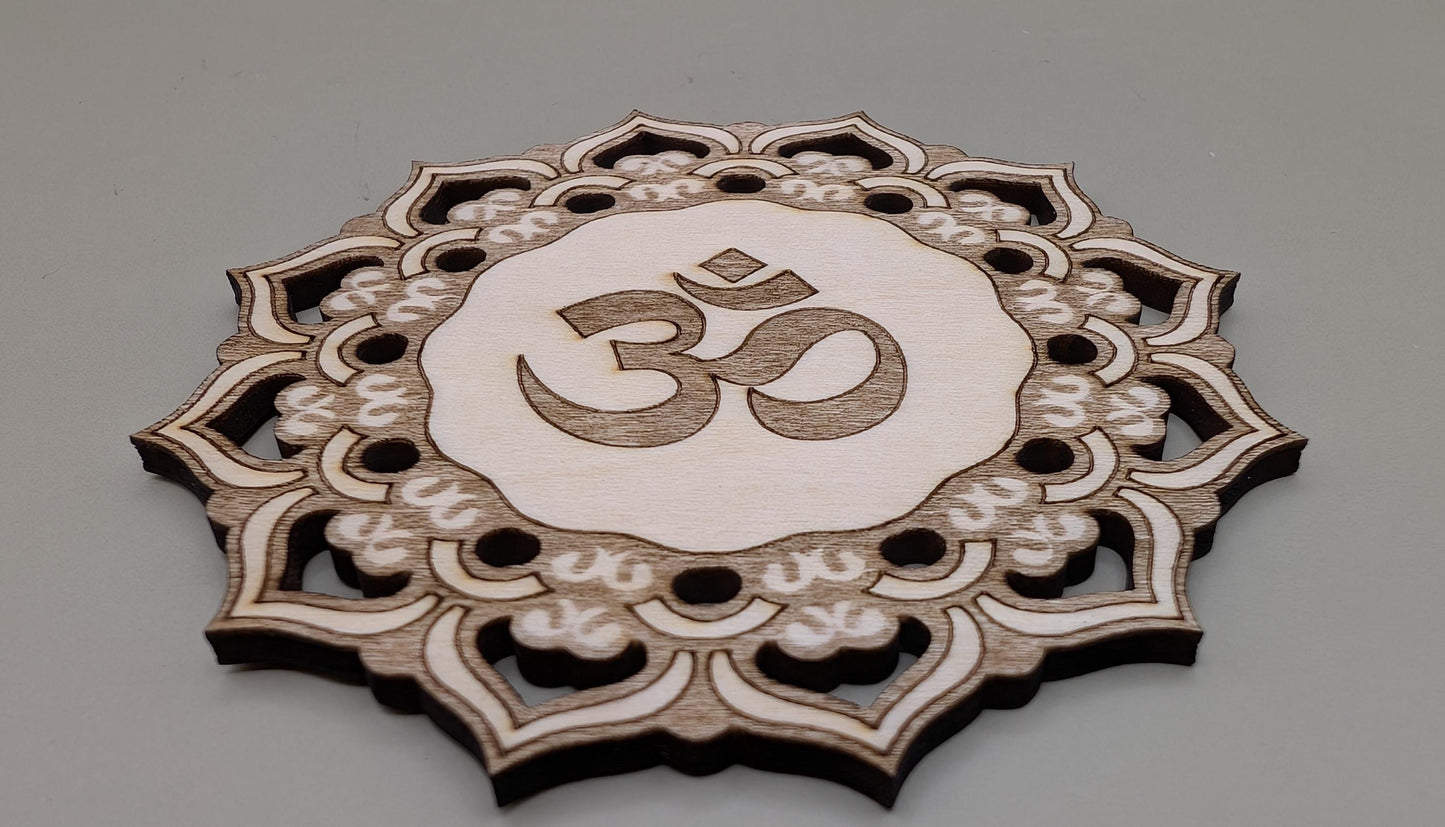 Decorative wooden coaster with Om symbol on a gray background