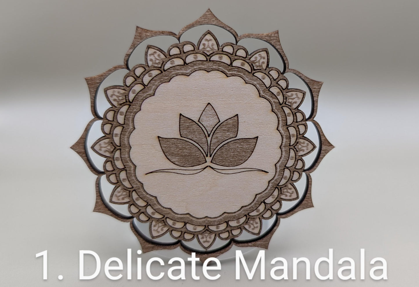 Wooden mandala with a leaf design on a gray background